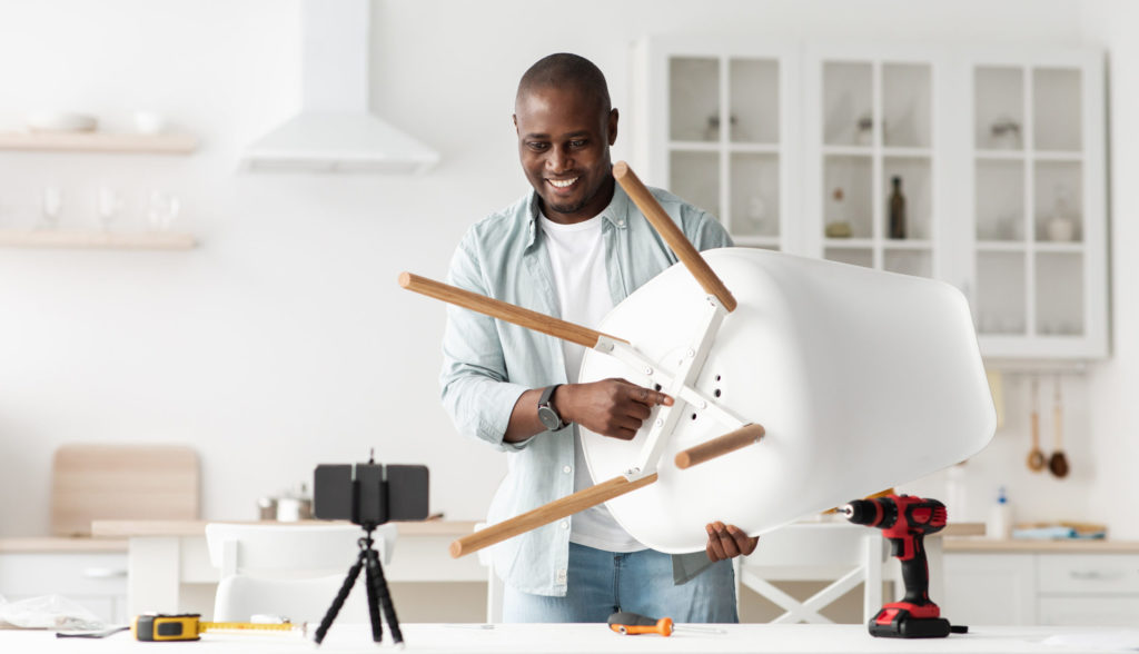 HANDYMAN FIXING A CHAIR